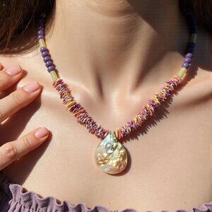 Walking on shells. Scalloped shell beaded medium length.